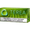 Green TEREA ZING WAVE tobacco product box for IQOS ILUMA with a large health-warning banner reading 'This tobacco product damages your health and is addictive'